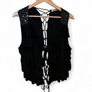 Black sequin ruffle vest with lace up back detail and adjustable ties in front